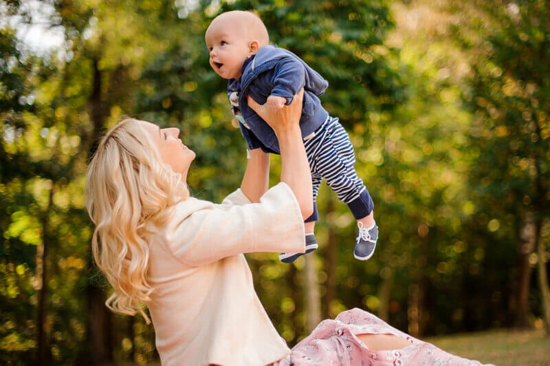 Premium Photo | Close up portrait of young attractive family with little  baby son, posing in beautiful autumn pine forest at sunny day