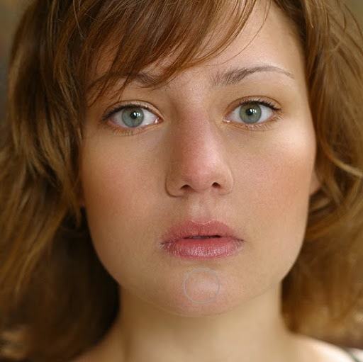 Showing the smooth skin in the lower areas of her face.